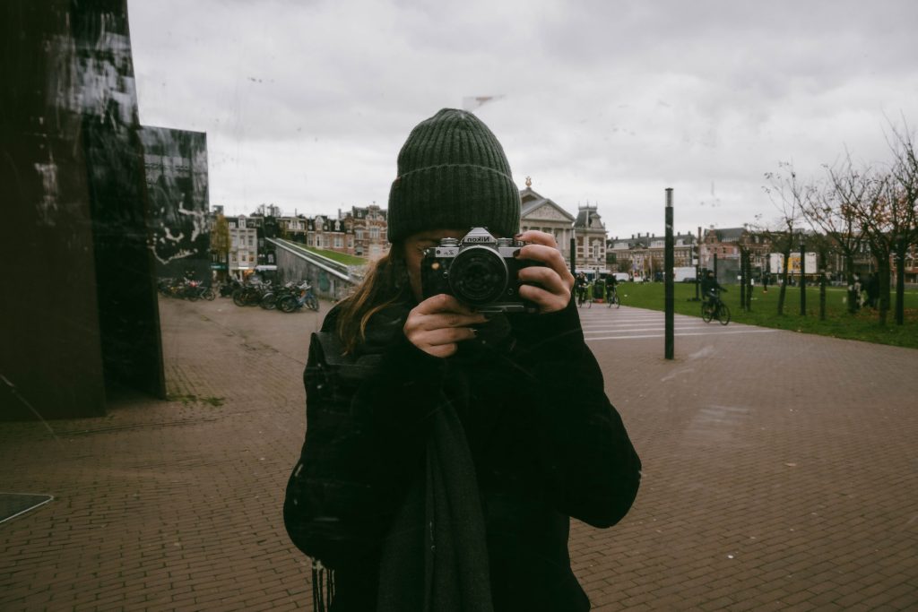 Self-portrait of Núria holding a camera